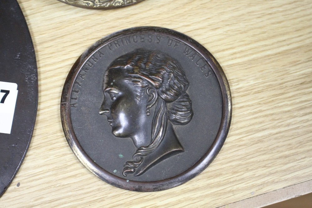 A Victorian bronze relief plaque of the young Queen Victoria, height 25cm, a bronzed metal plaque of Alexandra Princess of Wales with